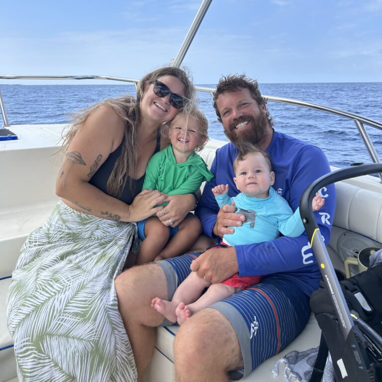 Captain Kevin, Tasha, and their two sons on the Ocean Blue Kona boat